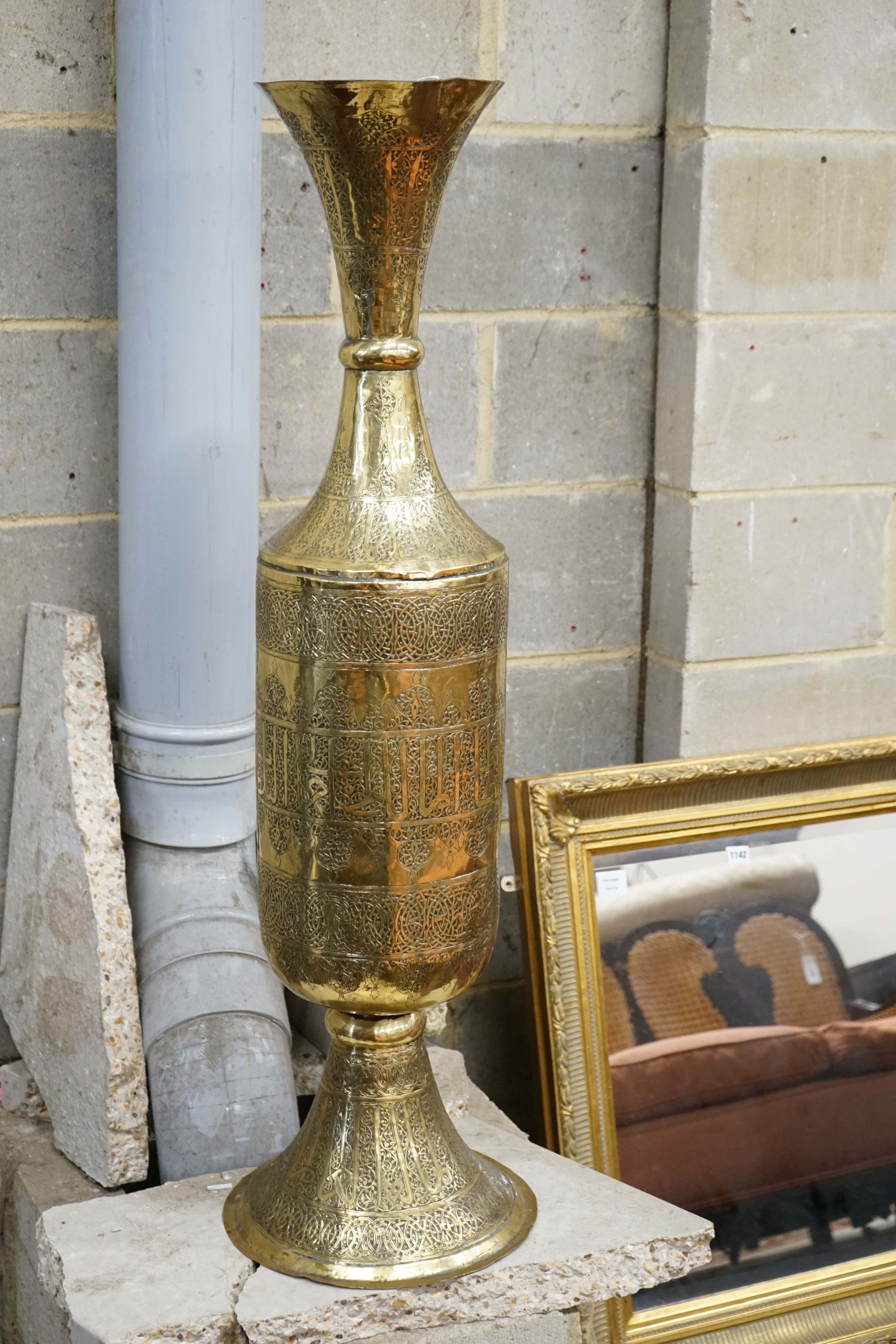 A large Syrian embossed brass floor vase, height 113cm